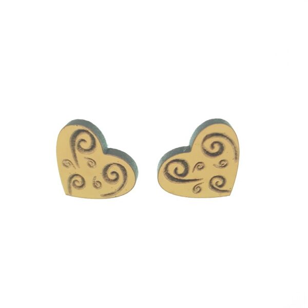 Wooden heart earrings with twirly engraved pattern